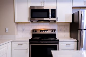 Stunning new kitchens with custom cabinetry and gleaming white granite countertops in select renovated homes! *